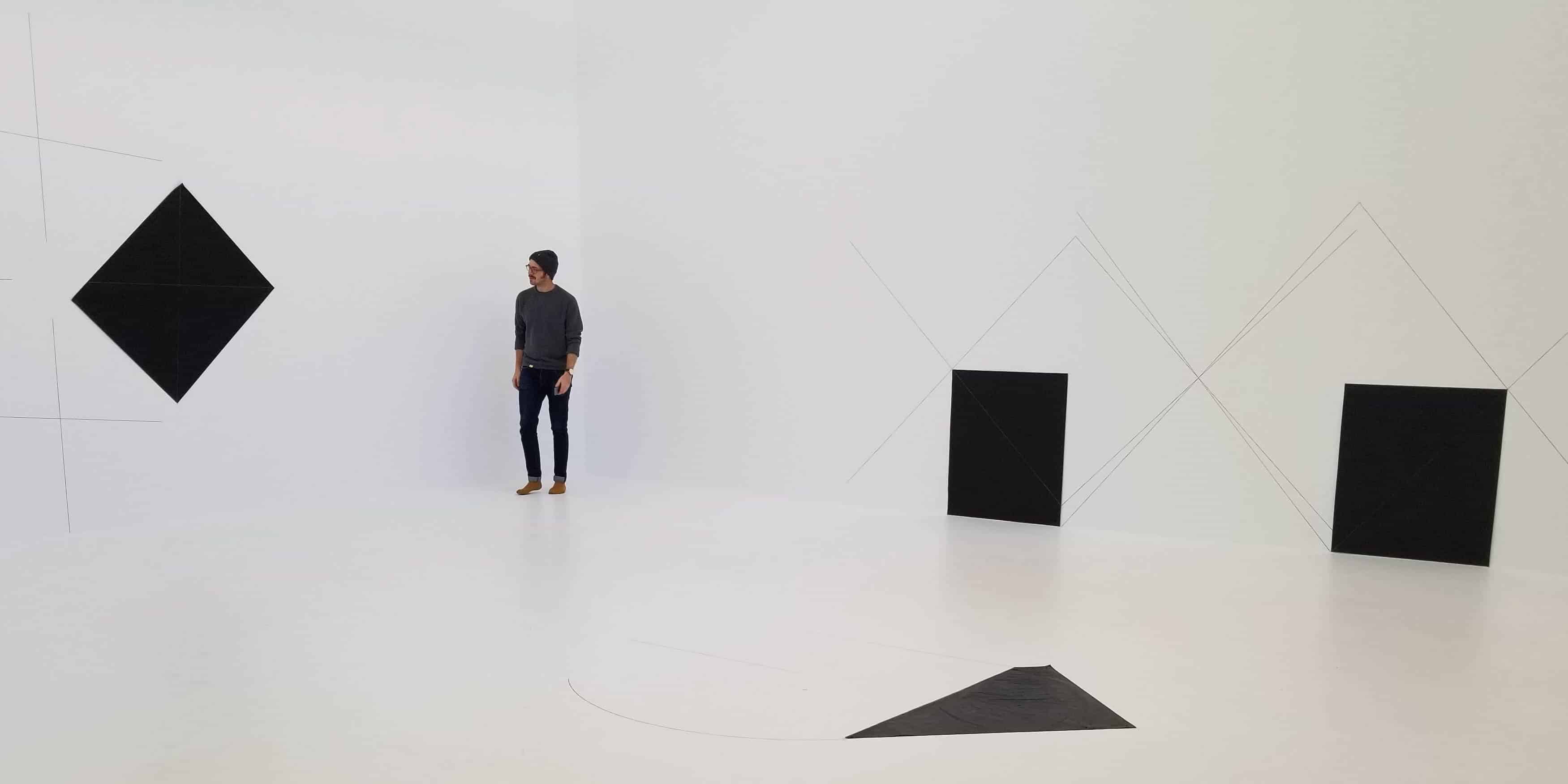 Sam walking through an exhibit in Dia.Beacon in New York.